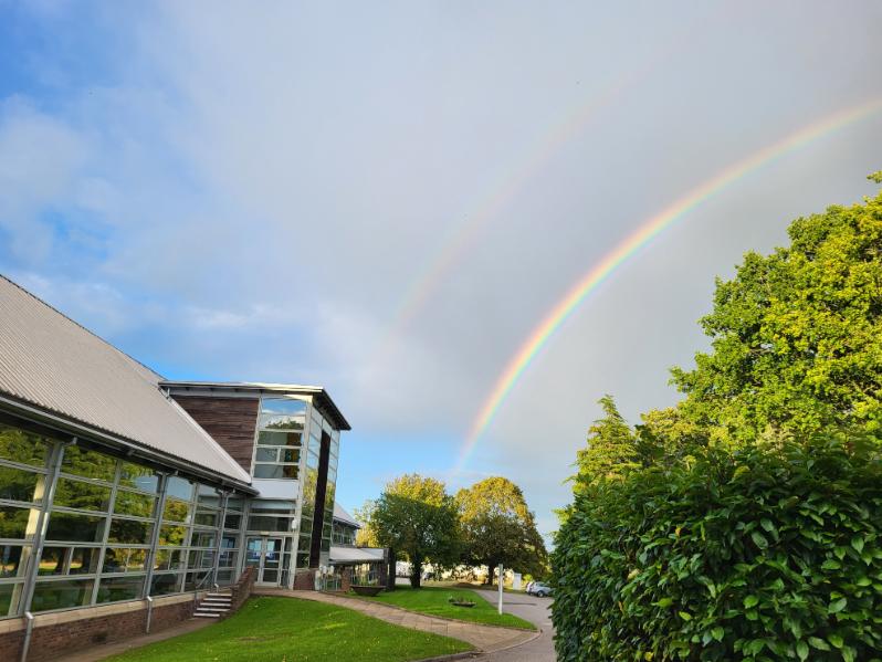 A double rainbow over a building