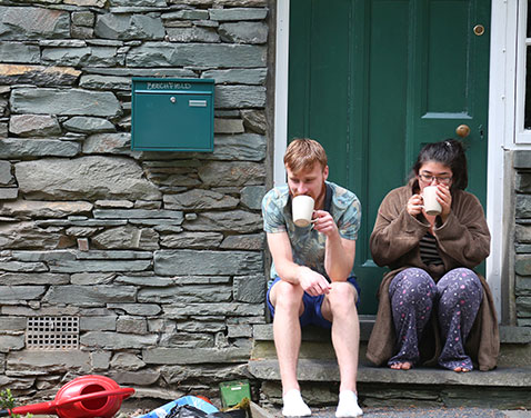 Ambleside accommodation: students sat outside the front door 
