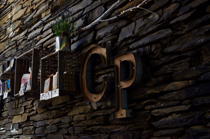 Ambleside Coffee Blog 3, Ambleside Coffee Blog: A photo of a wall which as the letters CP on it and some other storage decorations 