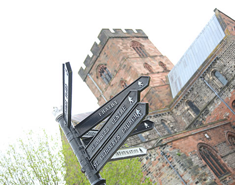 Carlisle City Centre with signpost.