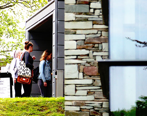 students entering a building
