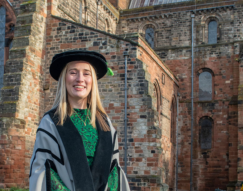 Helen Statham with Carlisle Cathedral in background