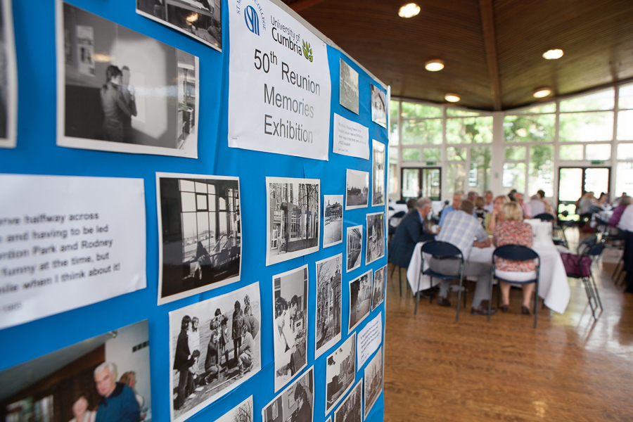 A board that reads "50th reunion memories exhibition".