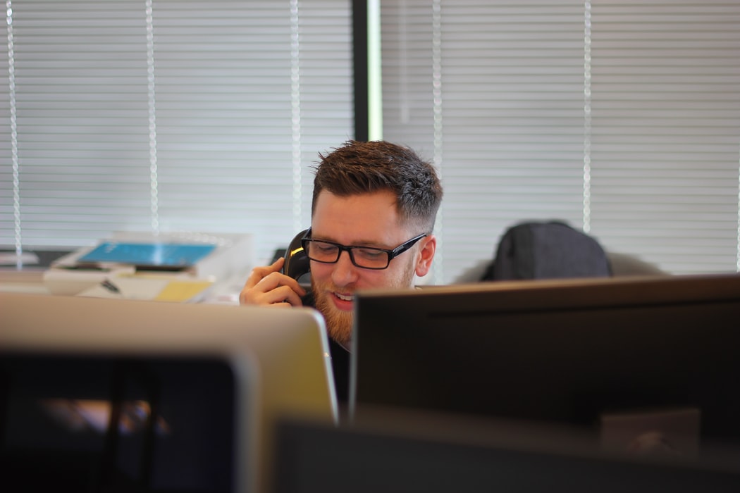 An admissions team member helping a student.