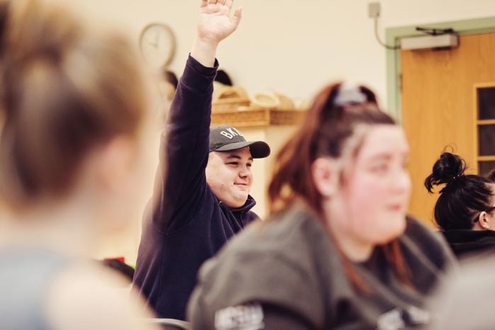 A student raising their hand.