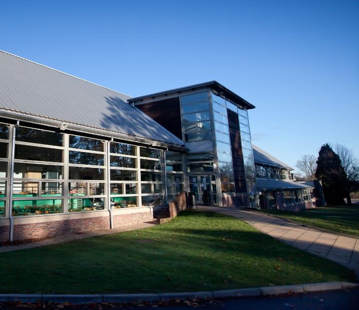 A glass front wood panelled building.