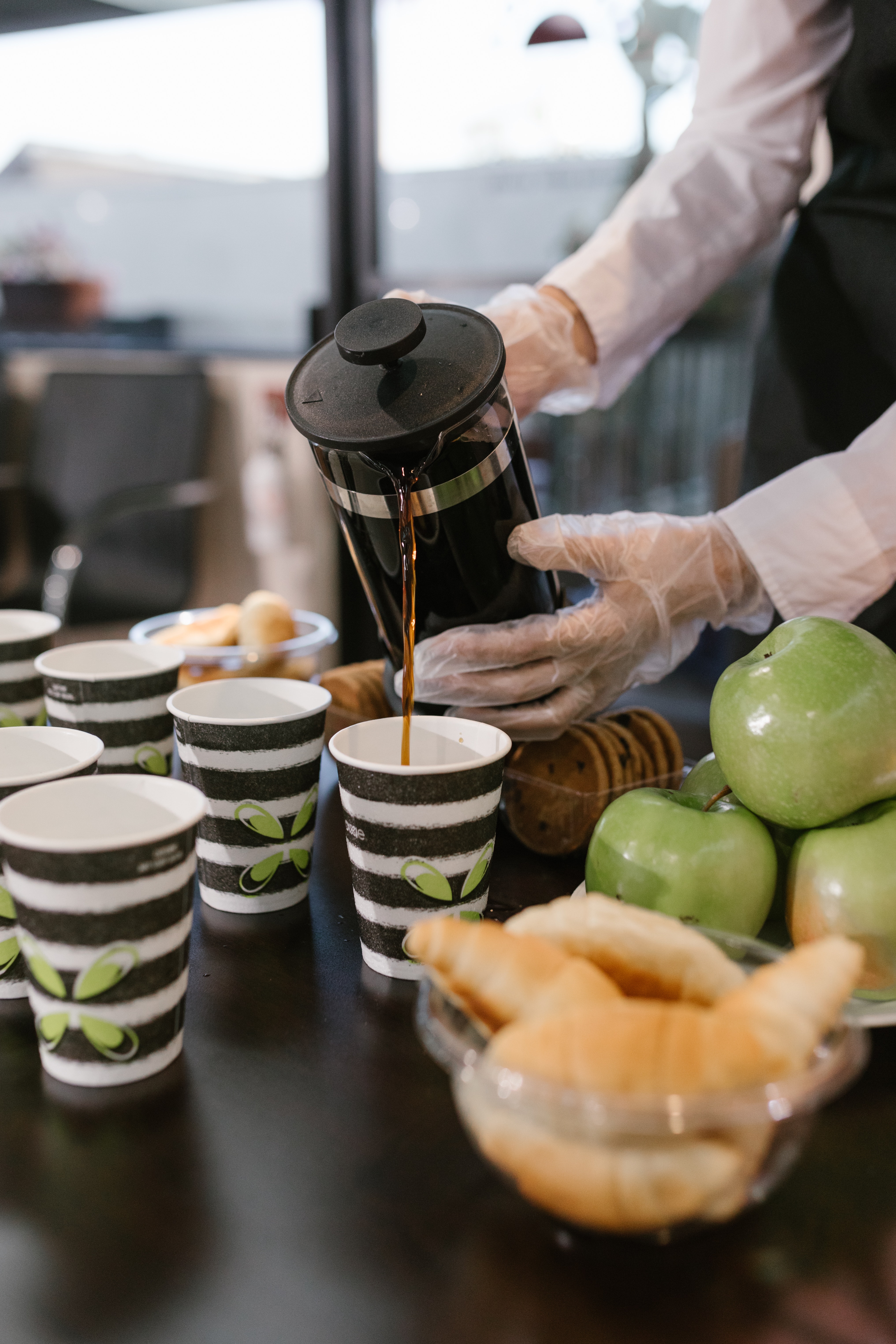 A person pouring coffee.