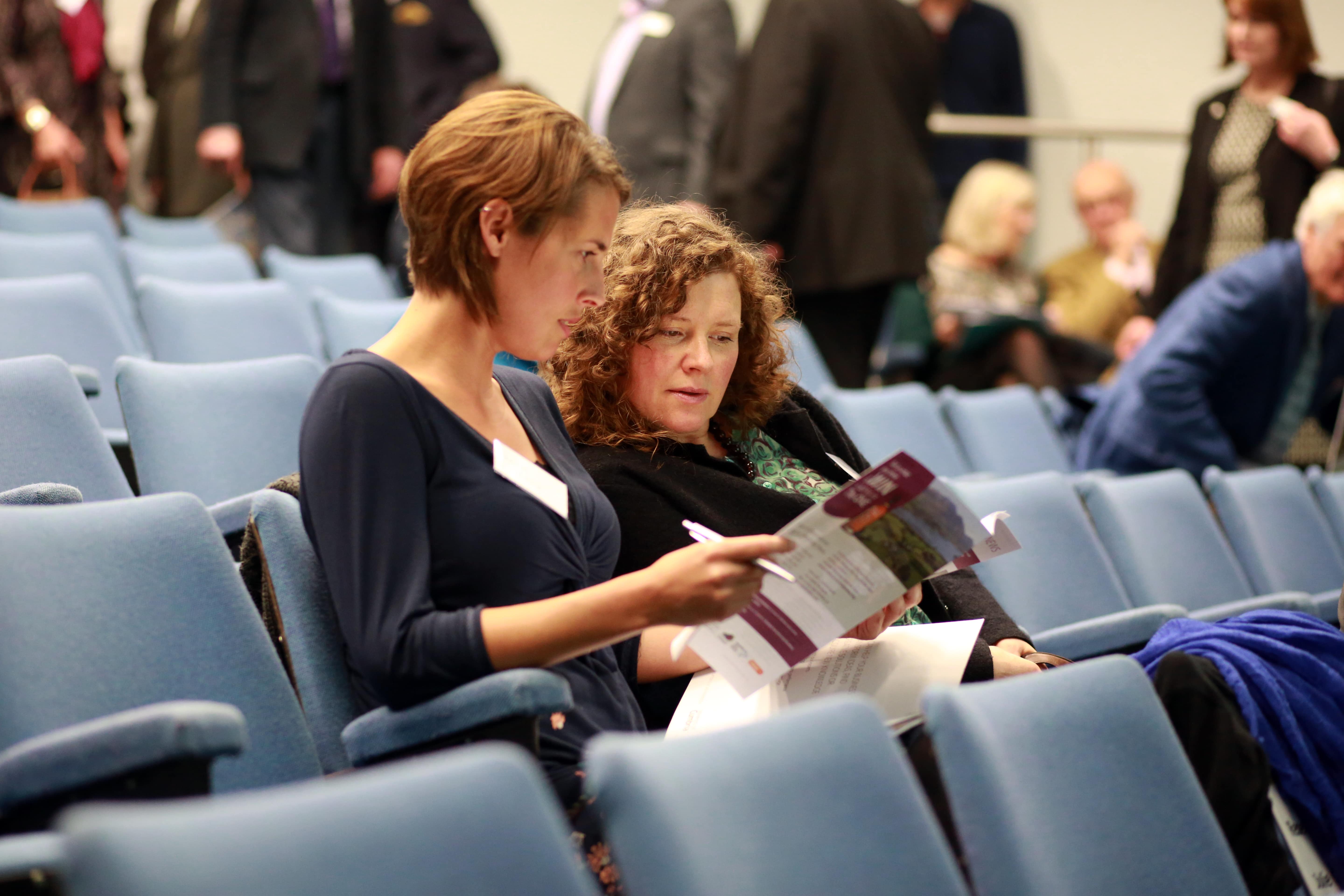 Two women in a lecturer suite.