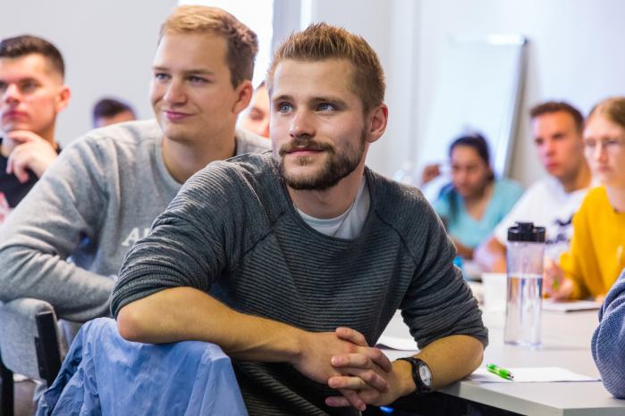 Young people in seminar room