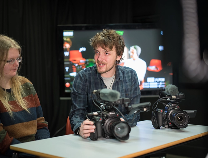 Two students in a film studio
