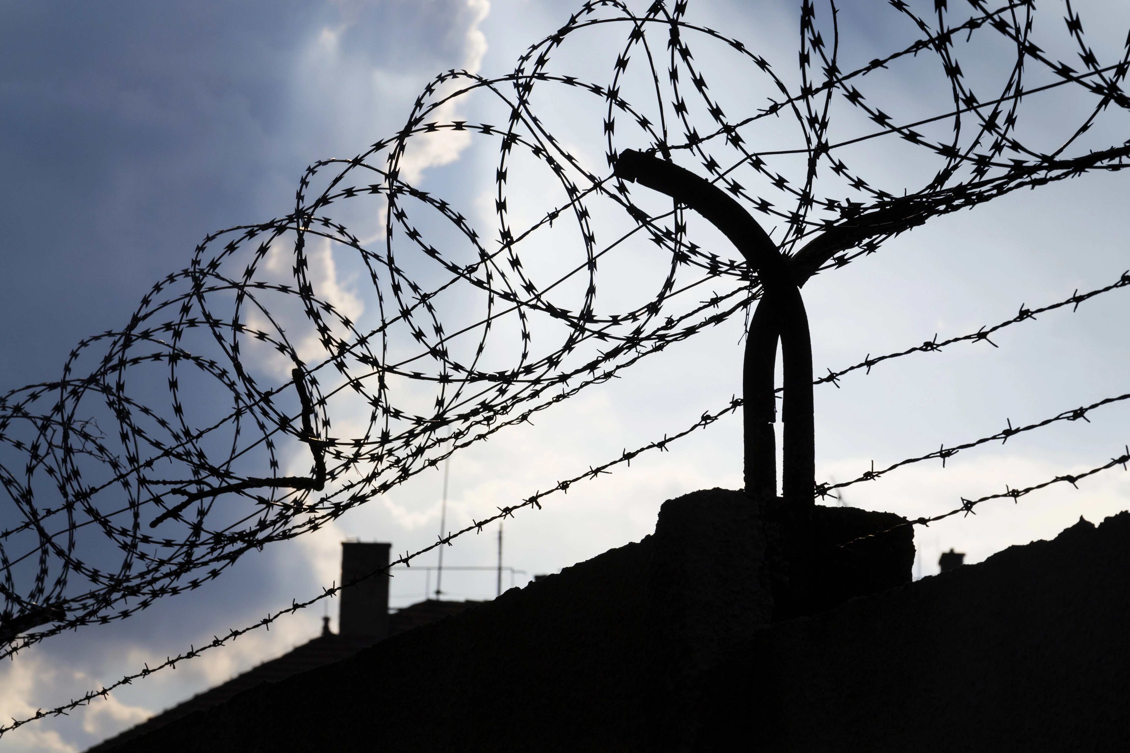 Barbed wire above prison walls