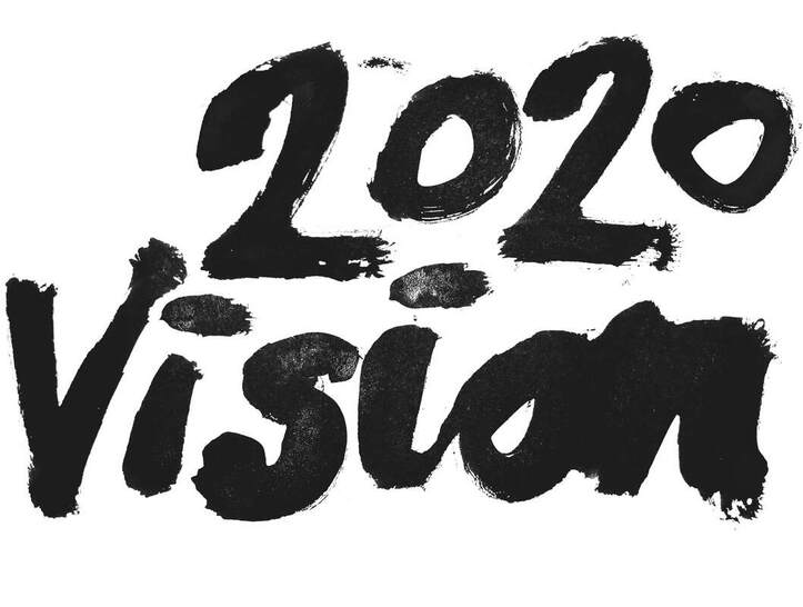 2020 Vision Art Degree Showcase, The words 2020 Vision painted using black paint.