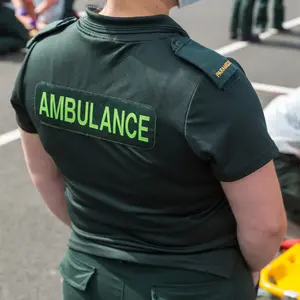 The back of a paramedic working