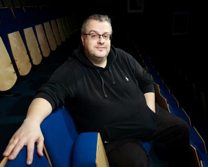 Brian Brooks - Stanwix Theatre Senior Technician, A portrait photograph of Brian Brooks in the theatre stands.