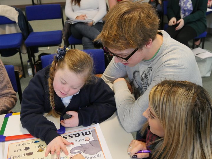 SEN Male and Female Teacher, photograph of a male and female SEN teacher working with a young female pupil