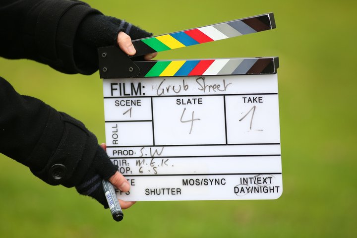 Media Arts - Filming, Someone wearing gloves, holding a clapperboard for the film 'grub sheet'