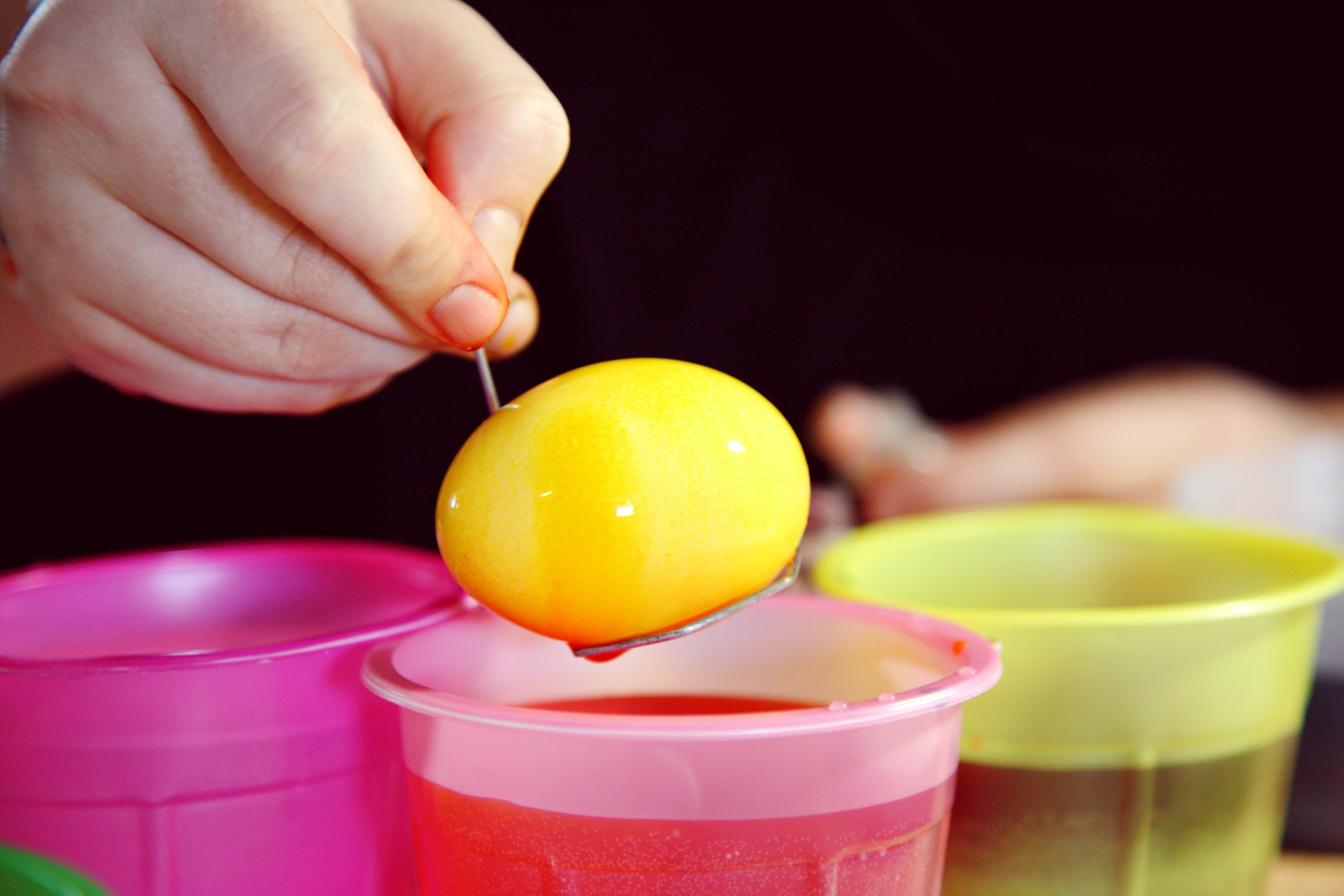 Easter Egg Dunking, egg being dunked in food colouring