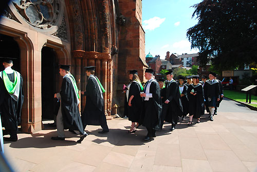 Students walking into the Cathedral for their graduation 