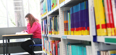 A student reading in the library