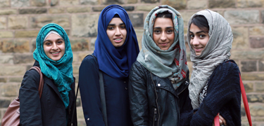 Girls in a row smiling