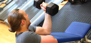 Man using weights in the gym