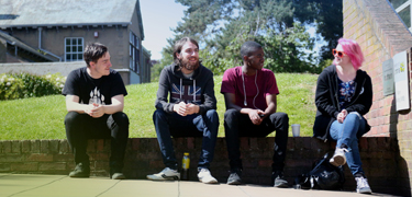 A group sat together smiling