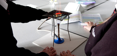 Students using Bunsen burners