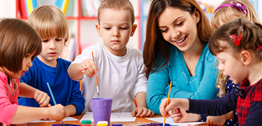  Group Of Elementary Age Children In Art Class With Teacher