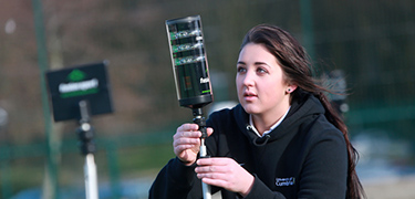 Sport course, student on astro turf