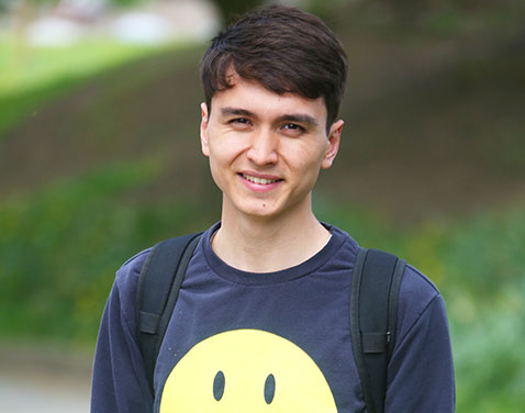 boy with smiley face tshirt