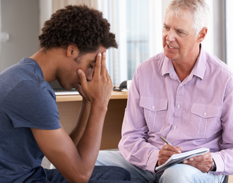 two men in counselling session.