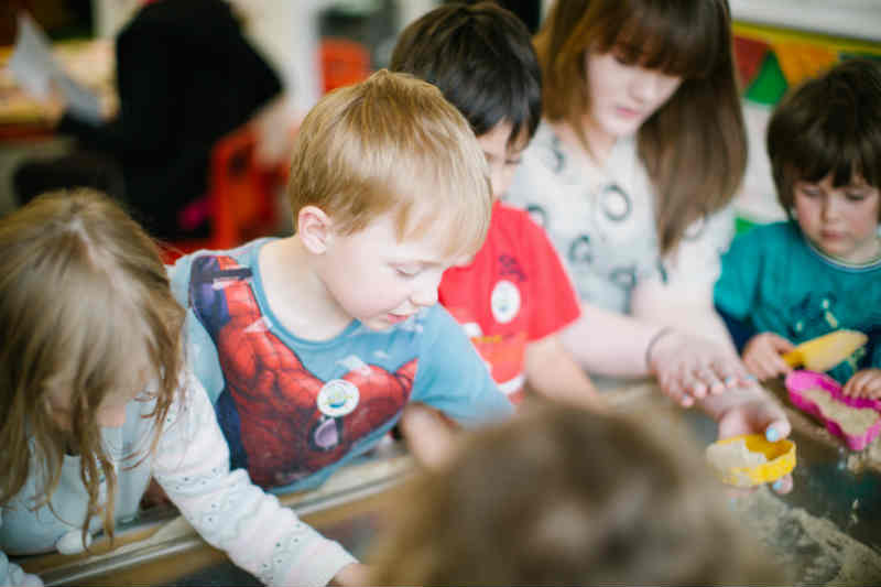 Female teacher primary, teacher in classroom with child