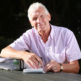 male with file and notepad