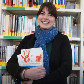 women smiling in the library