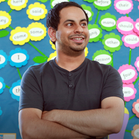 male smiling in a primary classroom