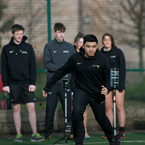 Male sports student running