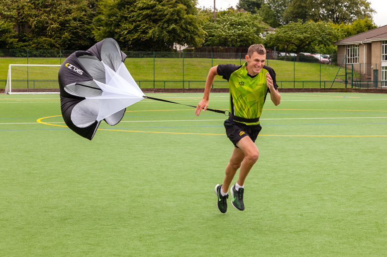 Sport student running on the pitch