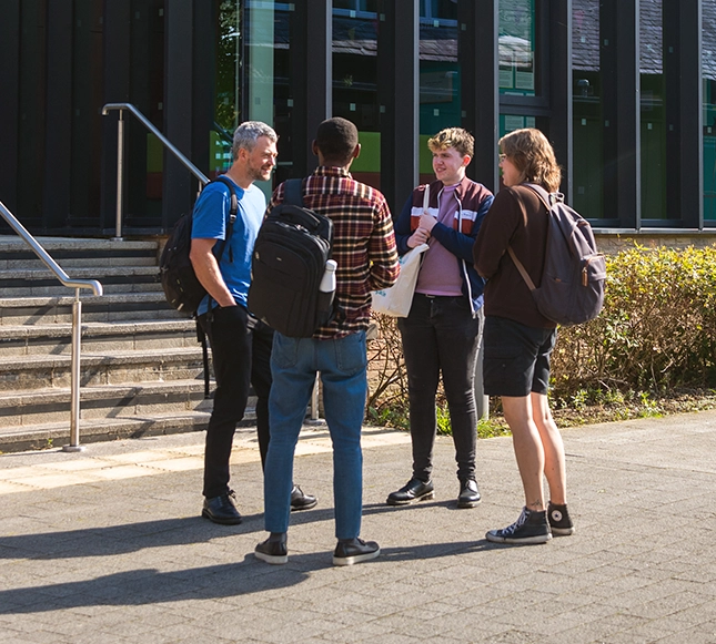 University students taking outside building