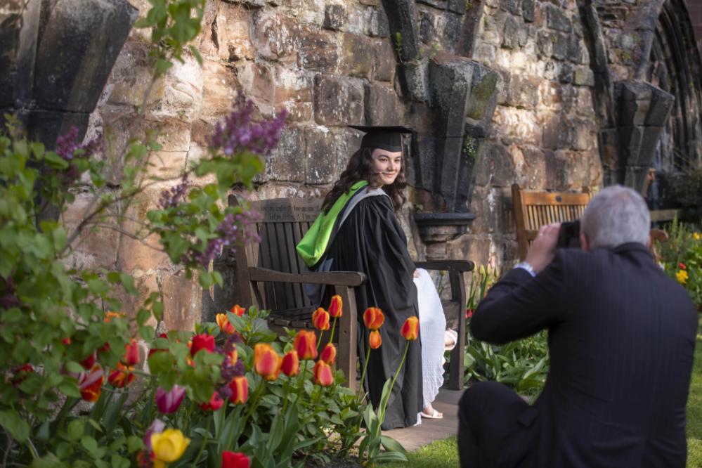 Graduand in Fratry courtyard