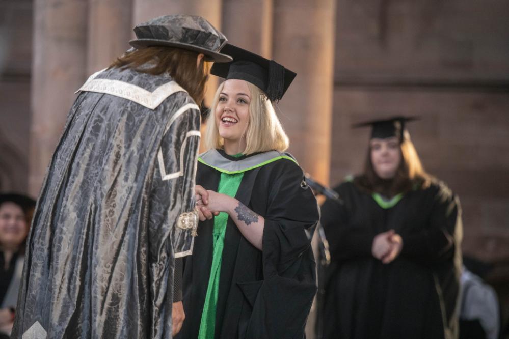 Graduate shakes hand with the VC