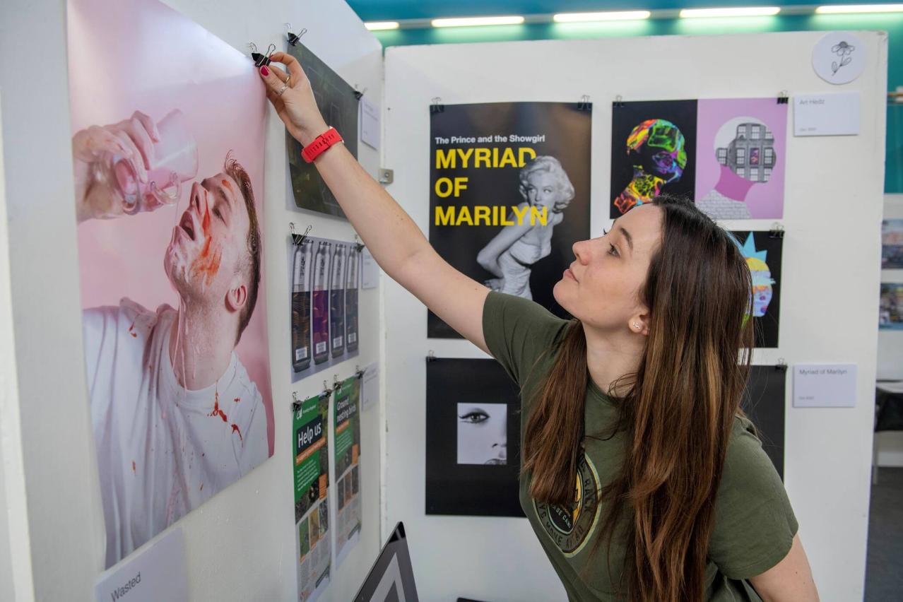 Hannah preparing her display at the Degree Show 2023