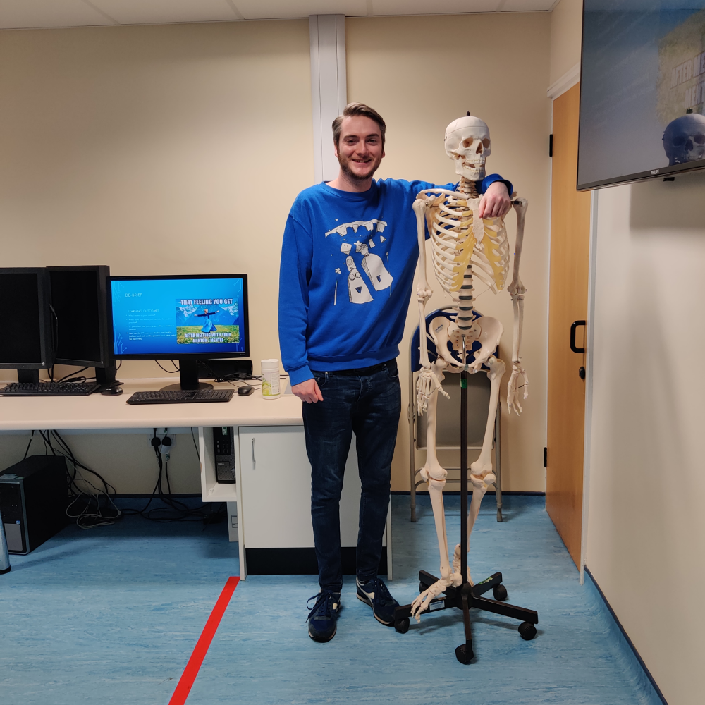 Sam next to one of our anatomical skeletons
