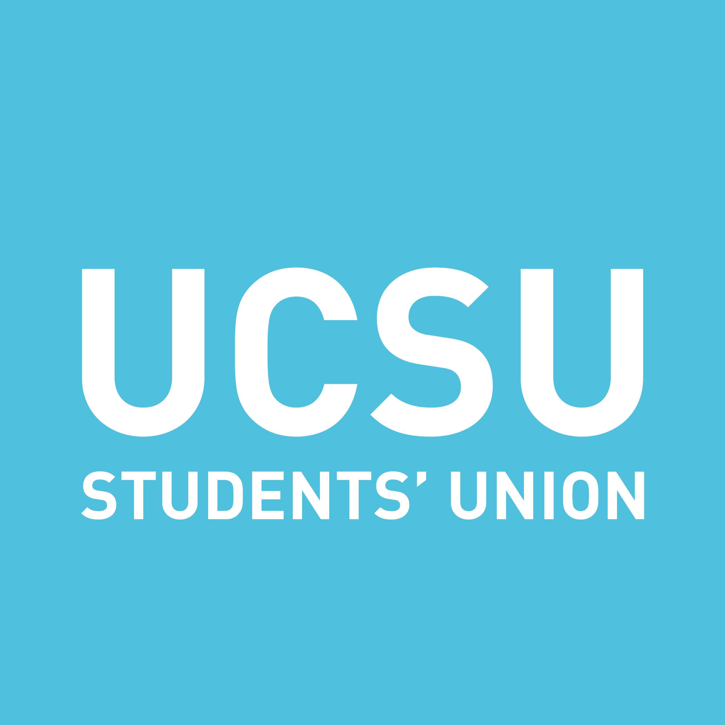 a woman in front of a painted wall.