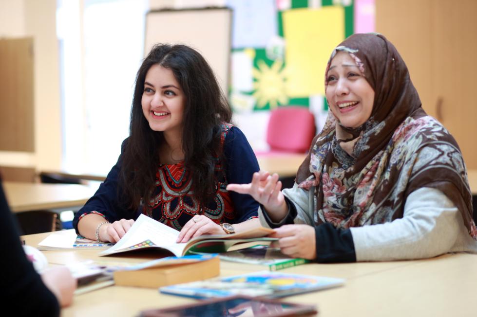 Two teaching students socialising.
