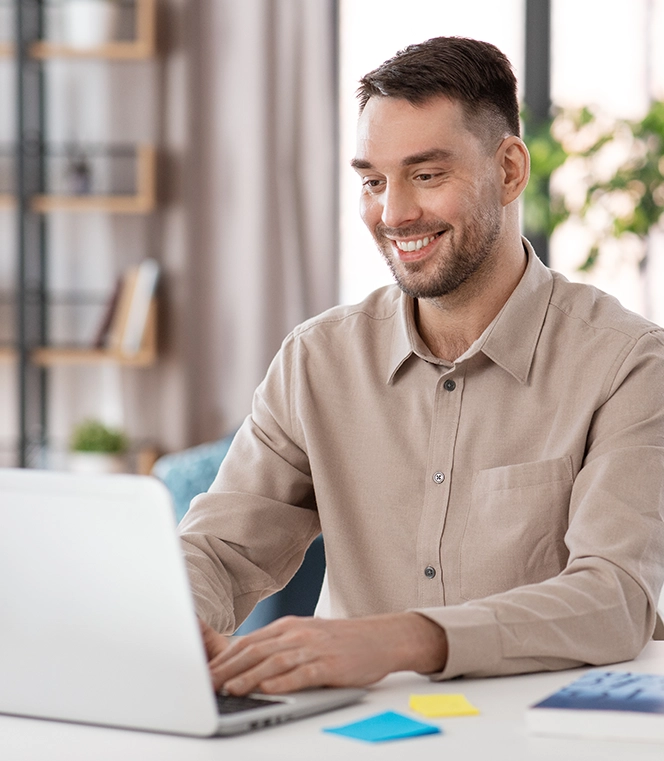 male teacher with laptop working at home office