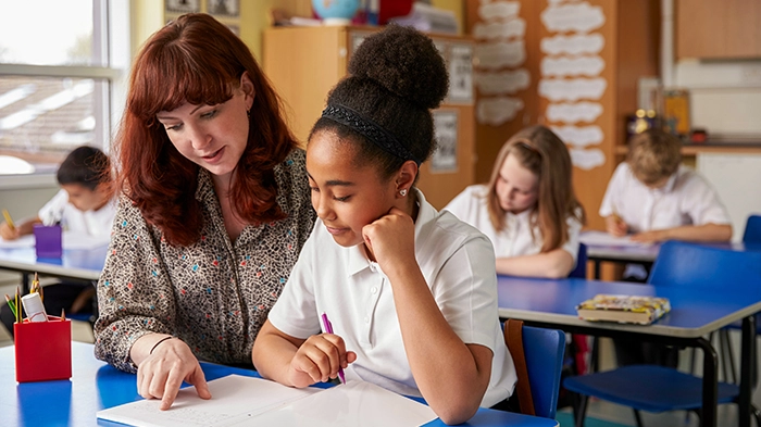 Teacher and a student in a classroom
