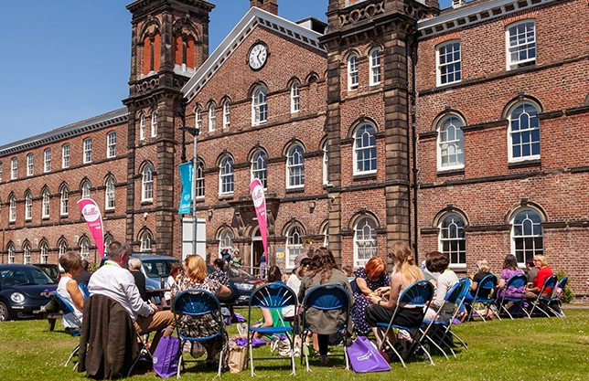 university students seating on grass