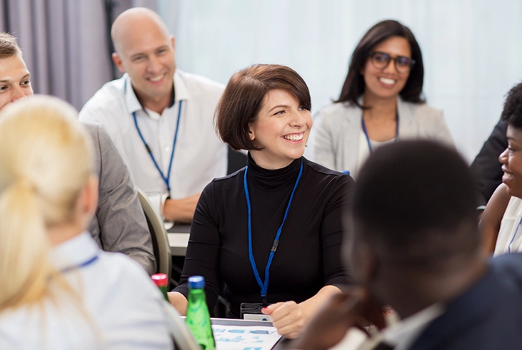 People in a room smiling