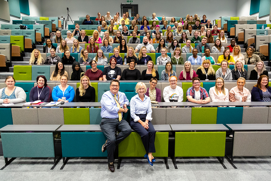 The nursing students sat in a lecture with the lecturers The nursing students sat in a lecture with the lecturers