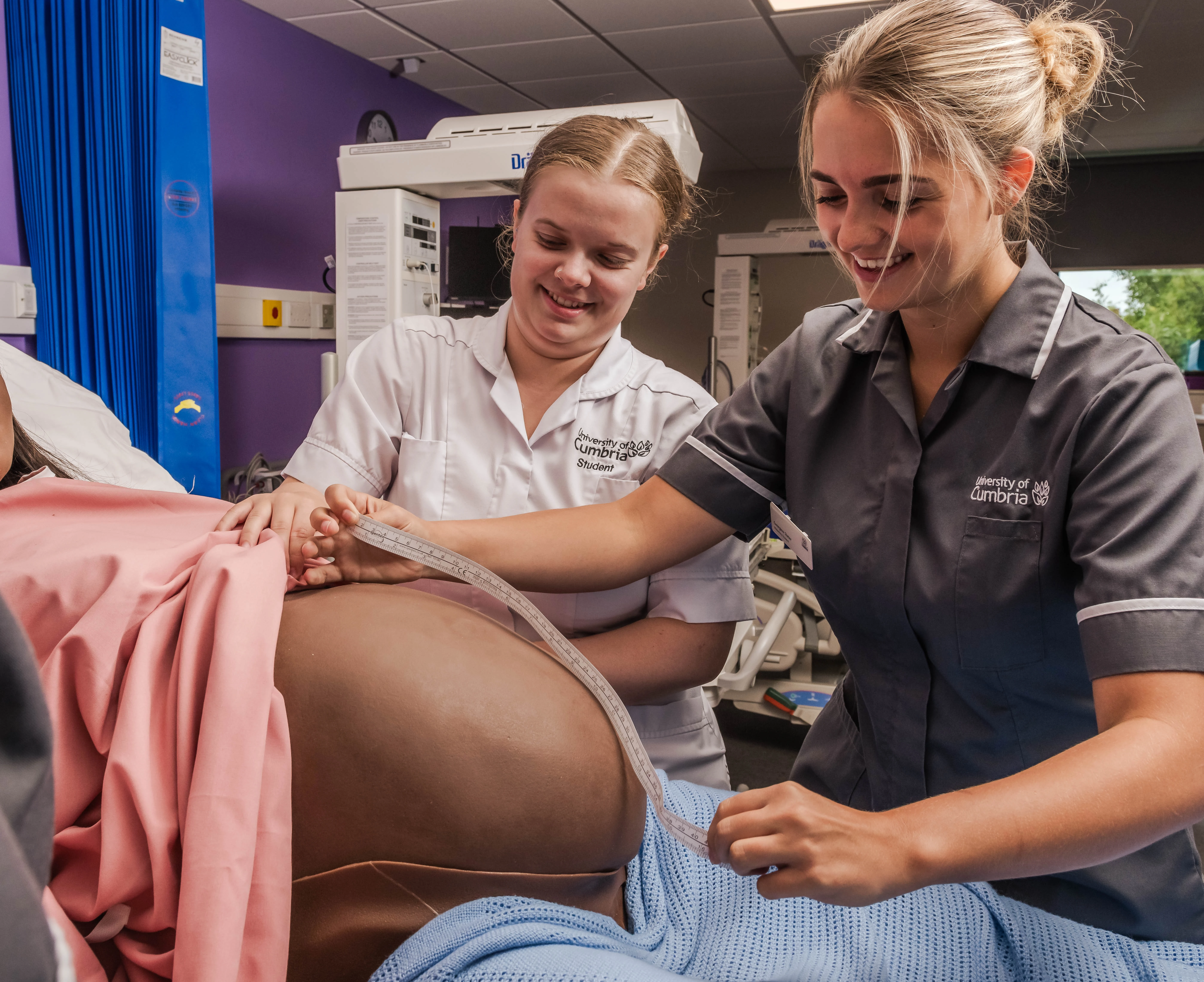 Midwifery students practising clinical skills
